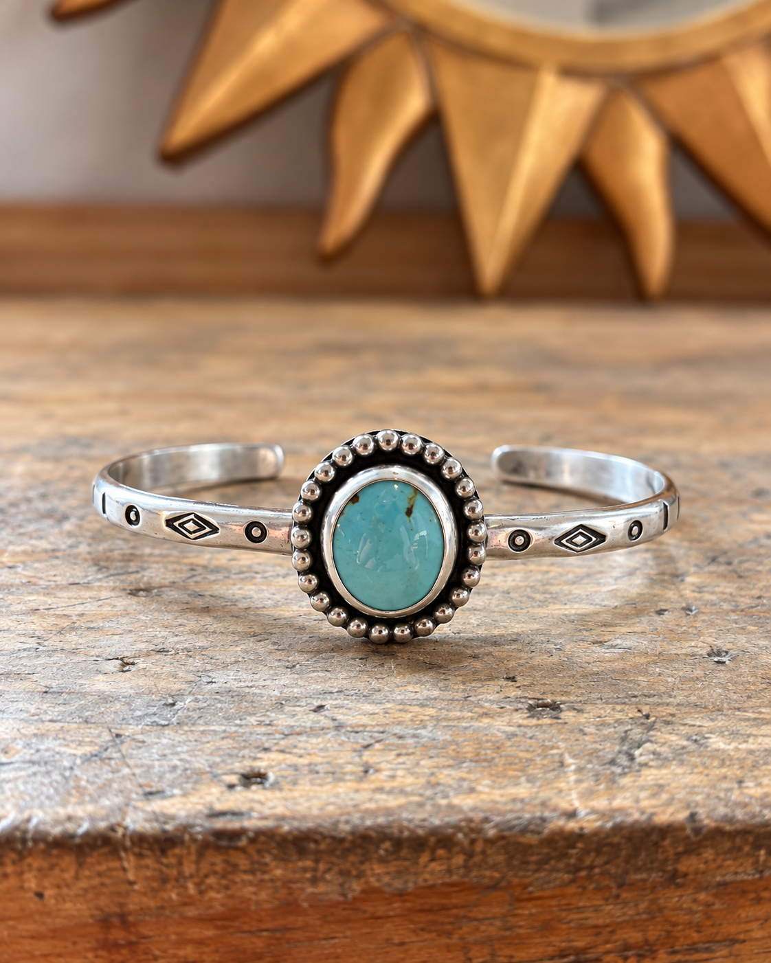 Handcrafted silver cuff with blue turquoise.png