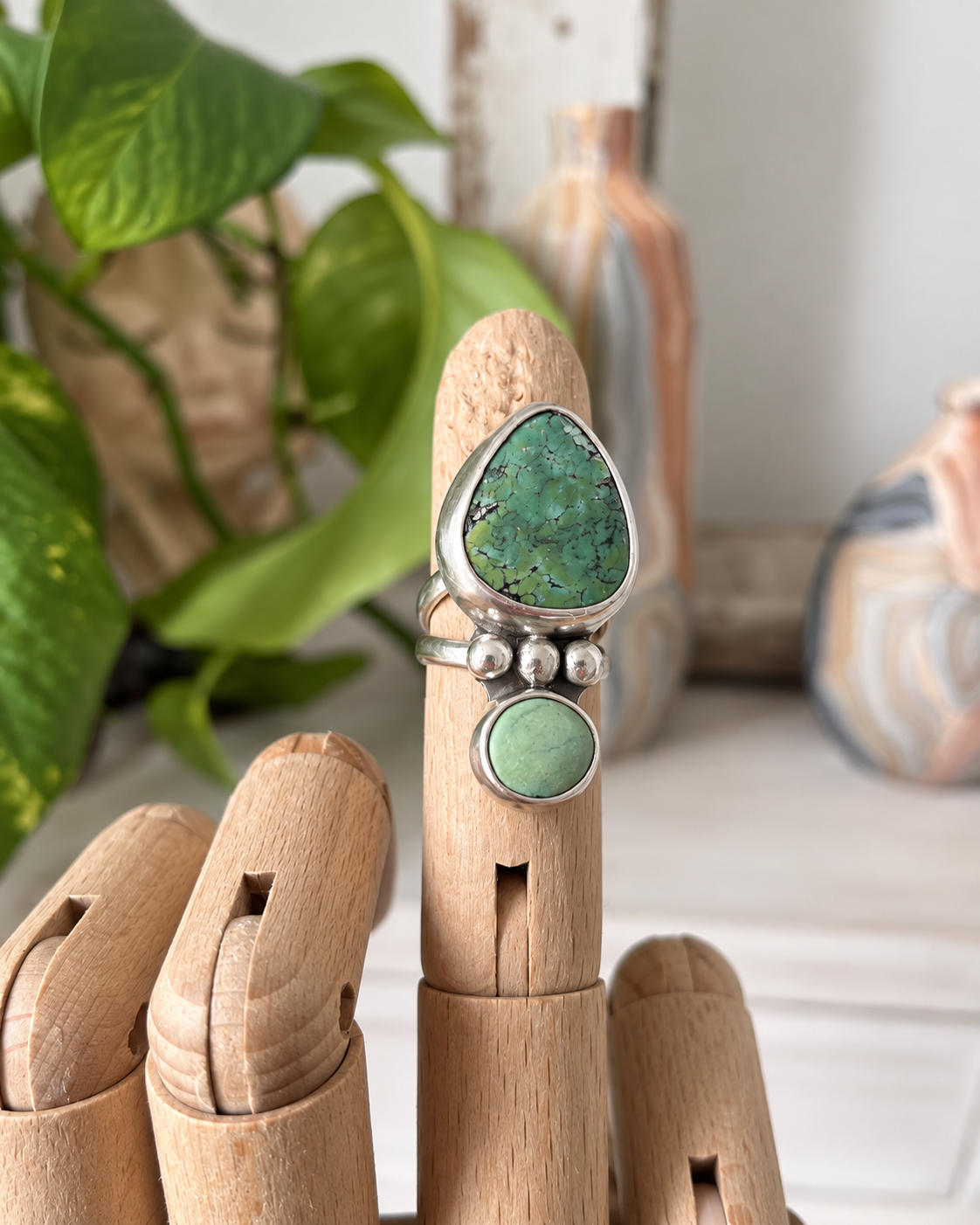 Handmade Turquoise Ring on Wooden Hand (1).png