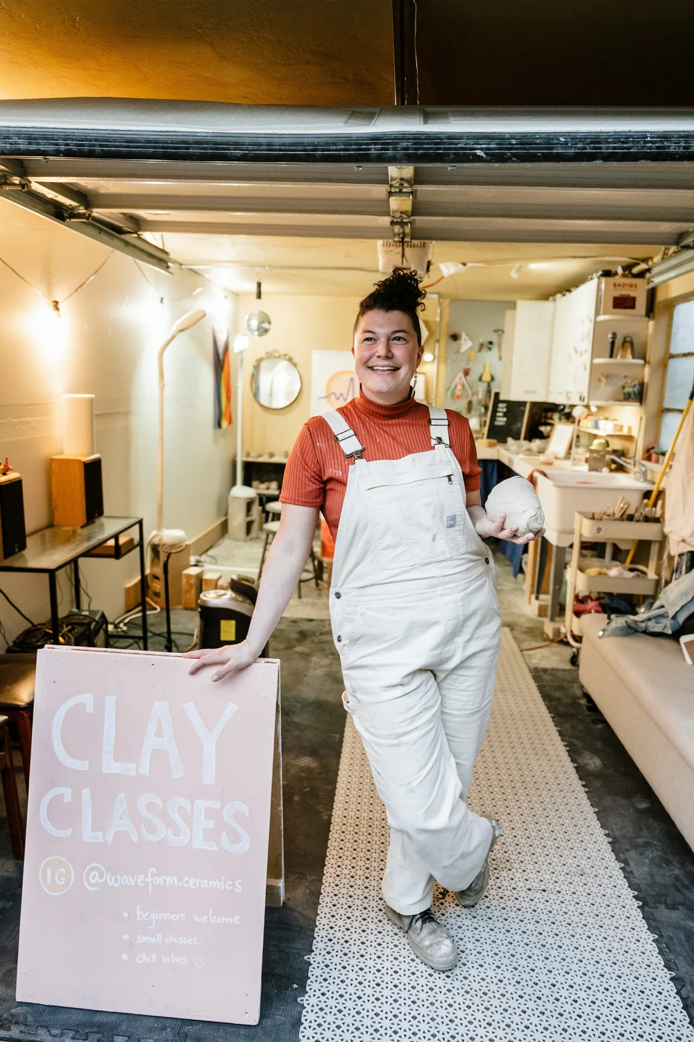  Caty Monahon, founder of Waveform Ceramics, greeting students for pottery class 