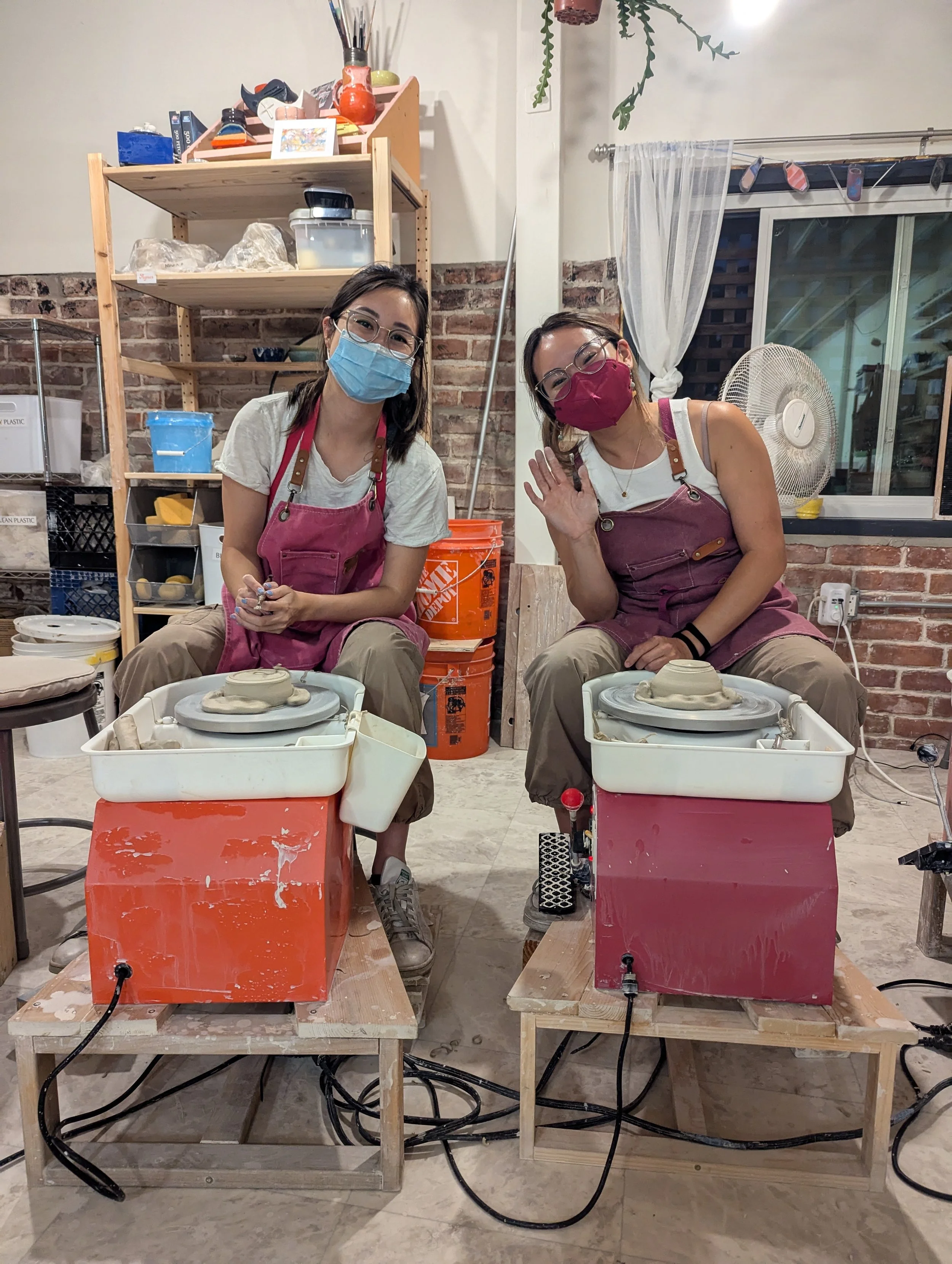 Friends hanging out in a pottery studio in the East Bay, friday night date night idea