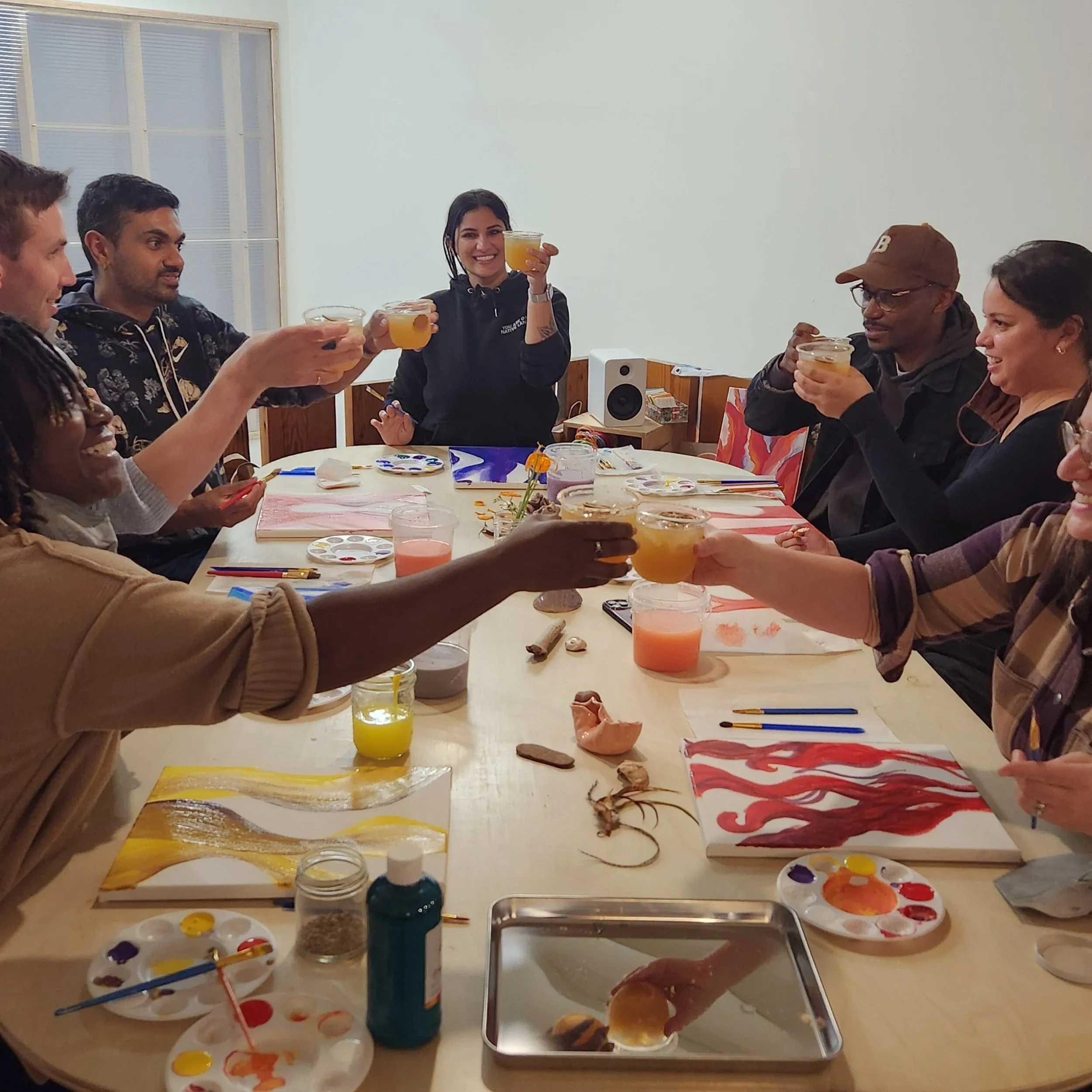 A group of beginners try acrylic painting with mocktails in a sober adult space