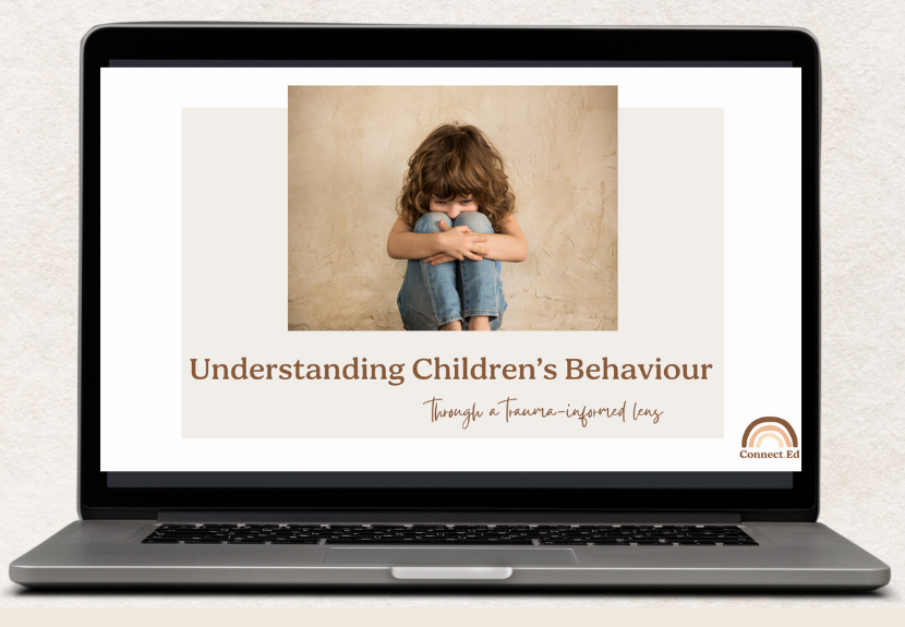 A laptop screen displaying a presentation titled "Understanding Children's Behaviour through a Trauma-informed lens" with a photo of a young girl sitting against a beige wall, hugging her knees with a sad expression.