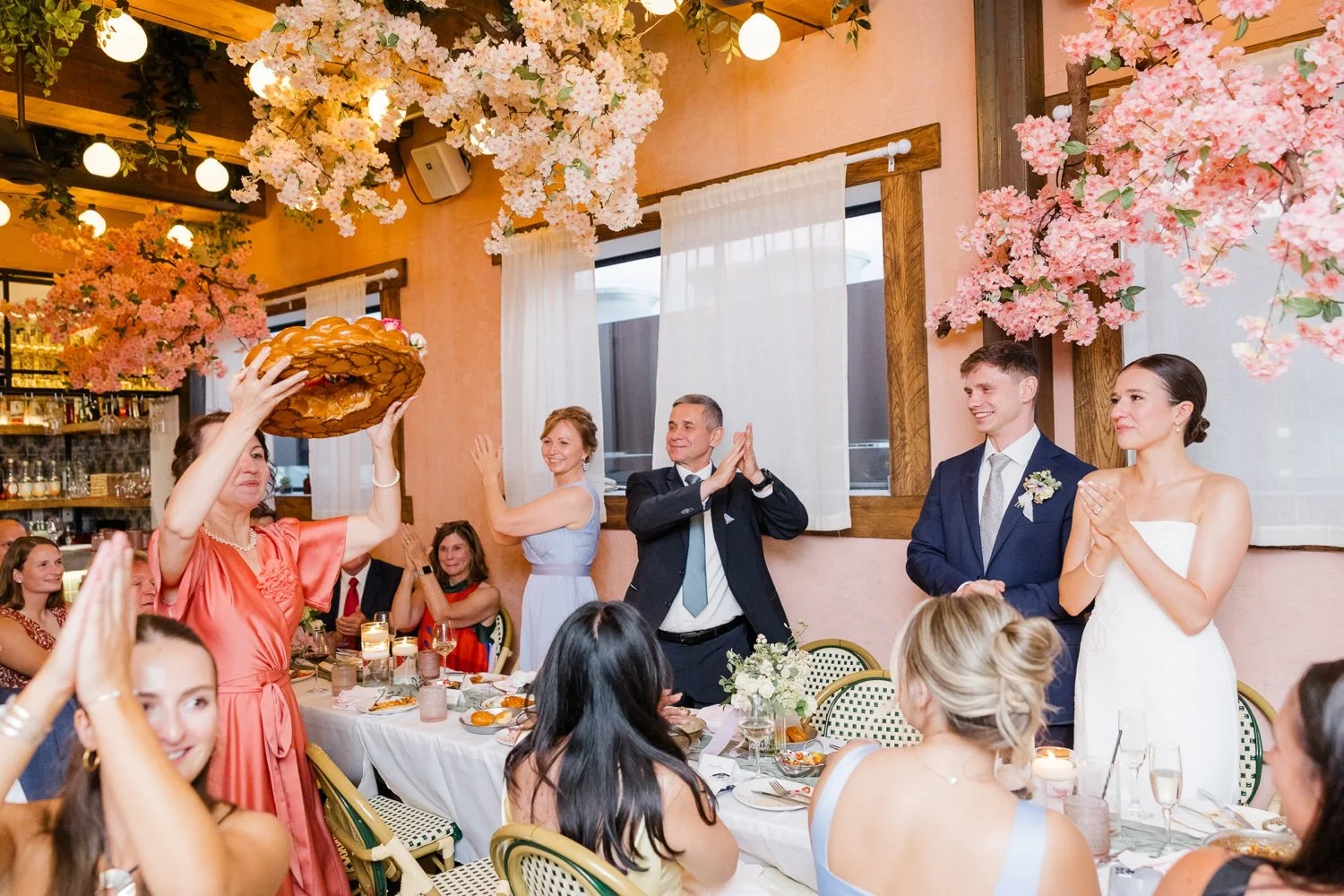 woman-holding-bread-at-ambar-rooftop-micro-wedding-on-capitol-hill-.jpg.jpg
