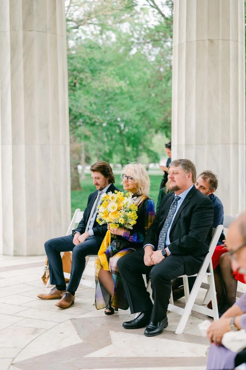 mother-of-the-bride-hold%E2%80%99s-the-brides-bouquet-at-small,-intimate-micro-wedding-.jpg.jpg