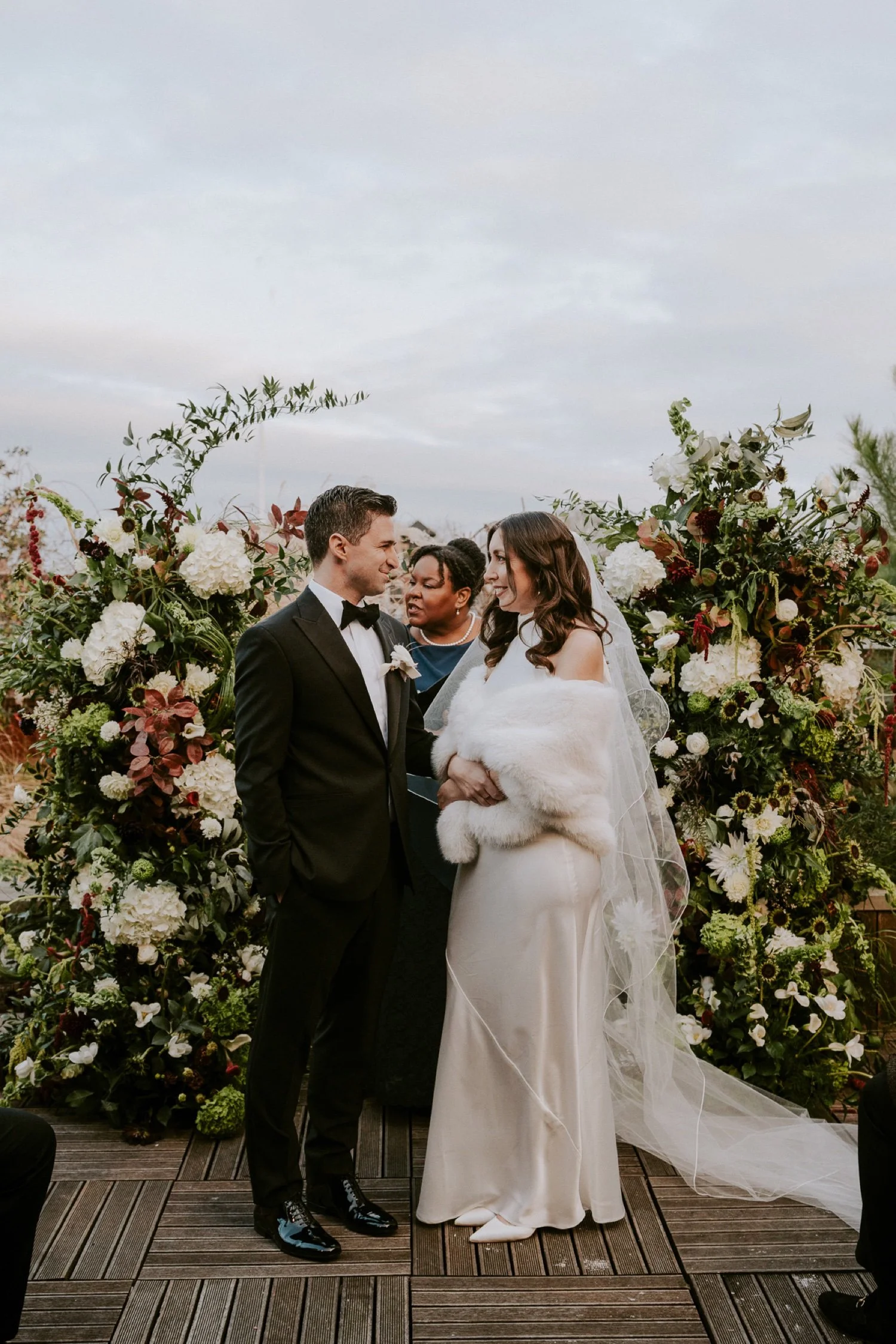 bride-and-groom-smile-at-one-another-at-penthouse-micro-wedding-ceremony-.jpg.jpg