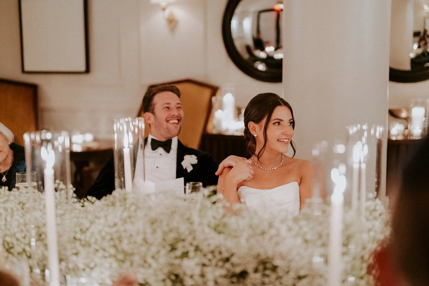 couple-listens-to-speaches-at-intimate-micro-wedding-dinner-at-riggs-hotel-.jpg.jpg