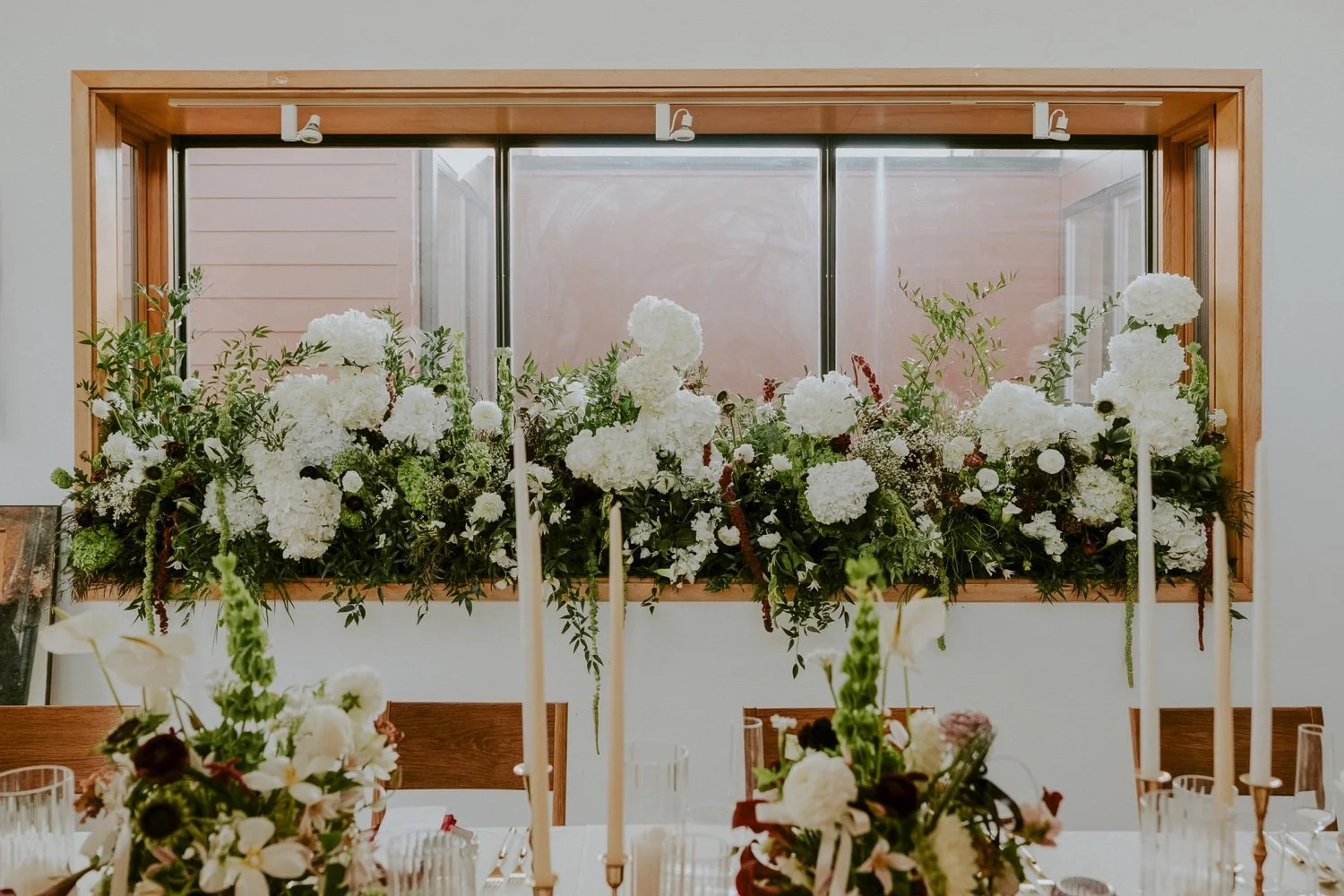 window-sill-full-of-burgundy-white-and-green-flowers-at-the-penthouse-in-washington-dc.jpg.jpg