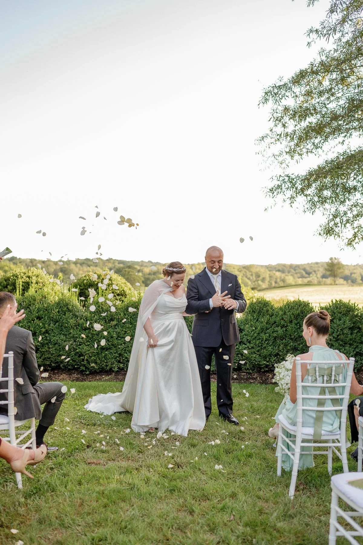  White rose petal toss after a garden ceremony overlooking the fields at Goodstone Inn 