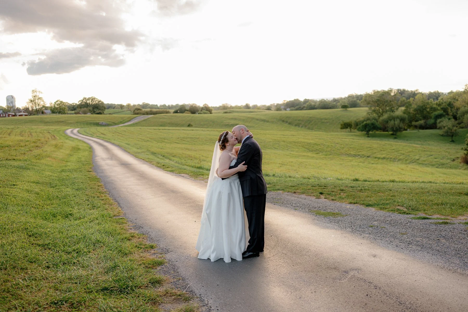 Couple on the farm road at Goodstone Inn, Middleburg, Virginia micro wedding