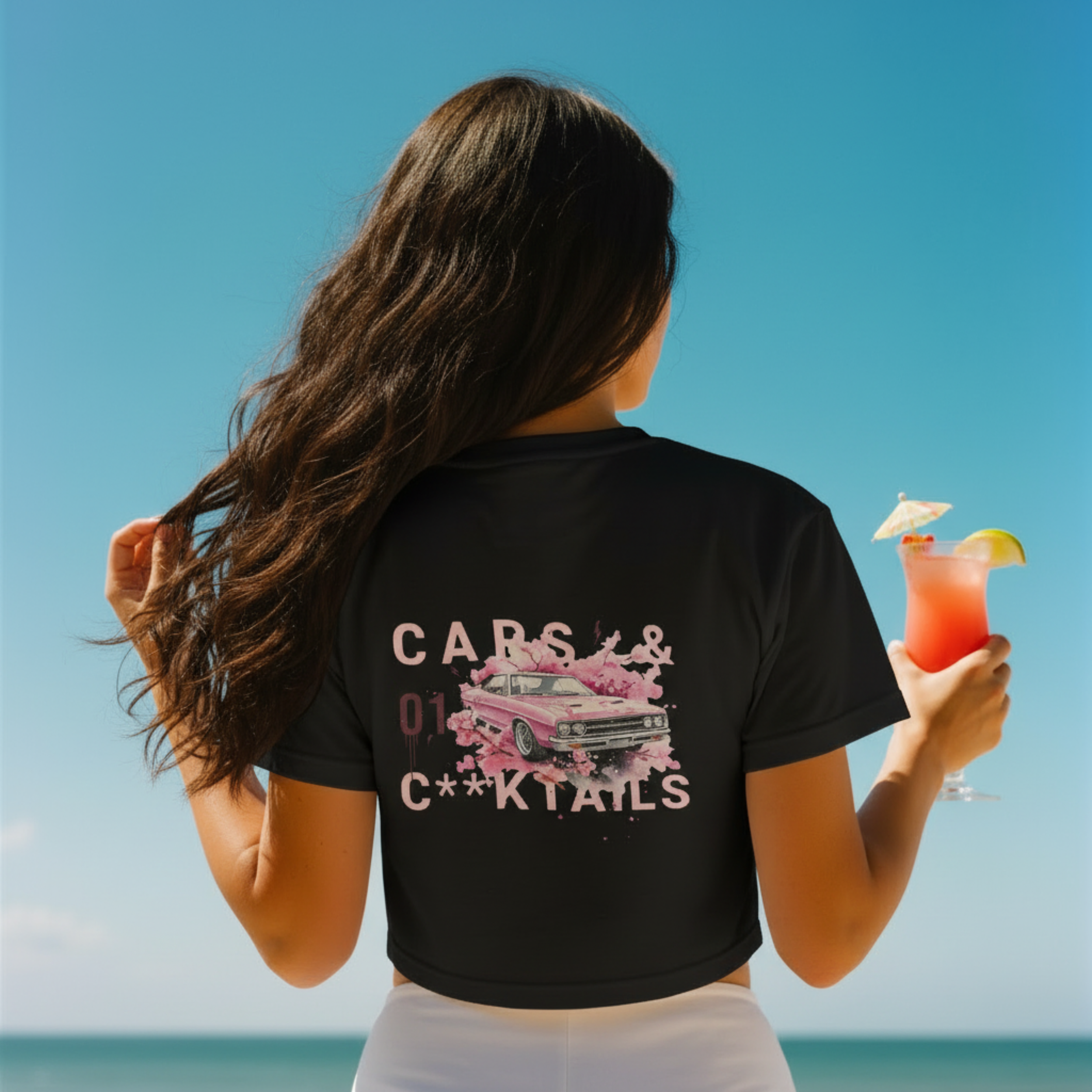 Cars and Cocktails black cropped streetwear t-shirt with a vintage pink muscle car graphic and white typography.