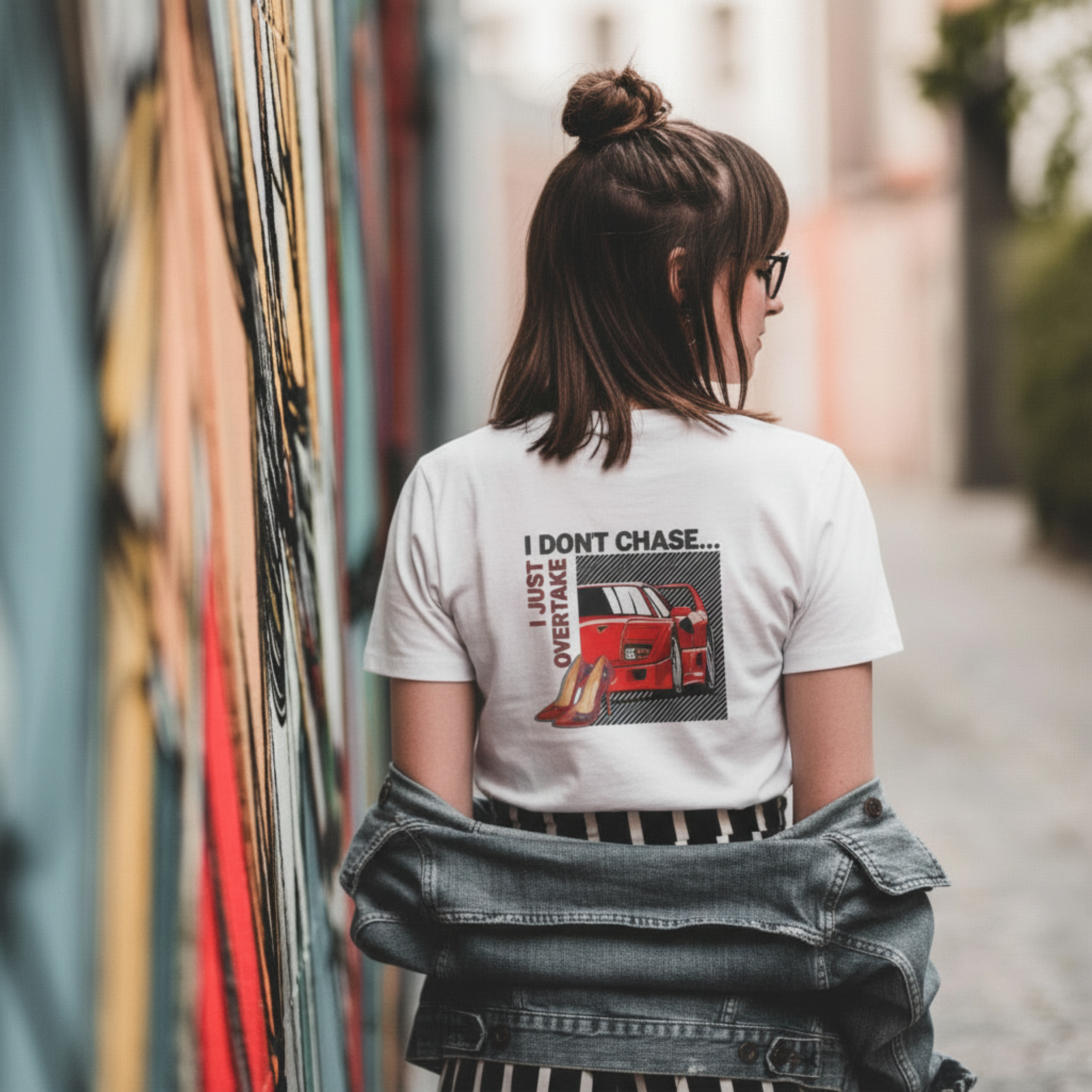 White graphic t-shirt by DRS Apparel featuring a red Ferrari F40 and red high heels with the text 'I Don't Chase... I Just Overtake' in a modern streetwear style.