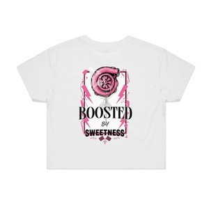 Boosted By Sweetness white fitted crop top featuring a pink turbocharger graphic and bold streetwear lettering.