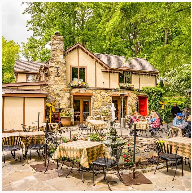 Old anglers inn with tables and chairs outside