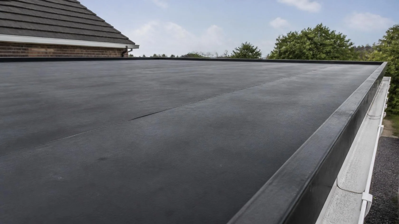 Close-up of a black EPDM rubber membrane roof on a Maryland home.