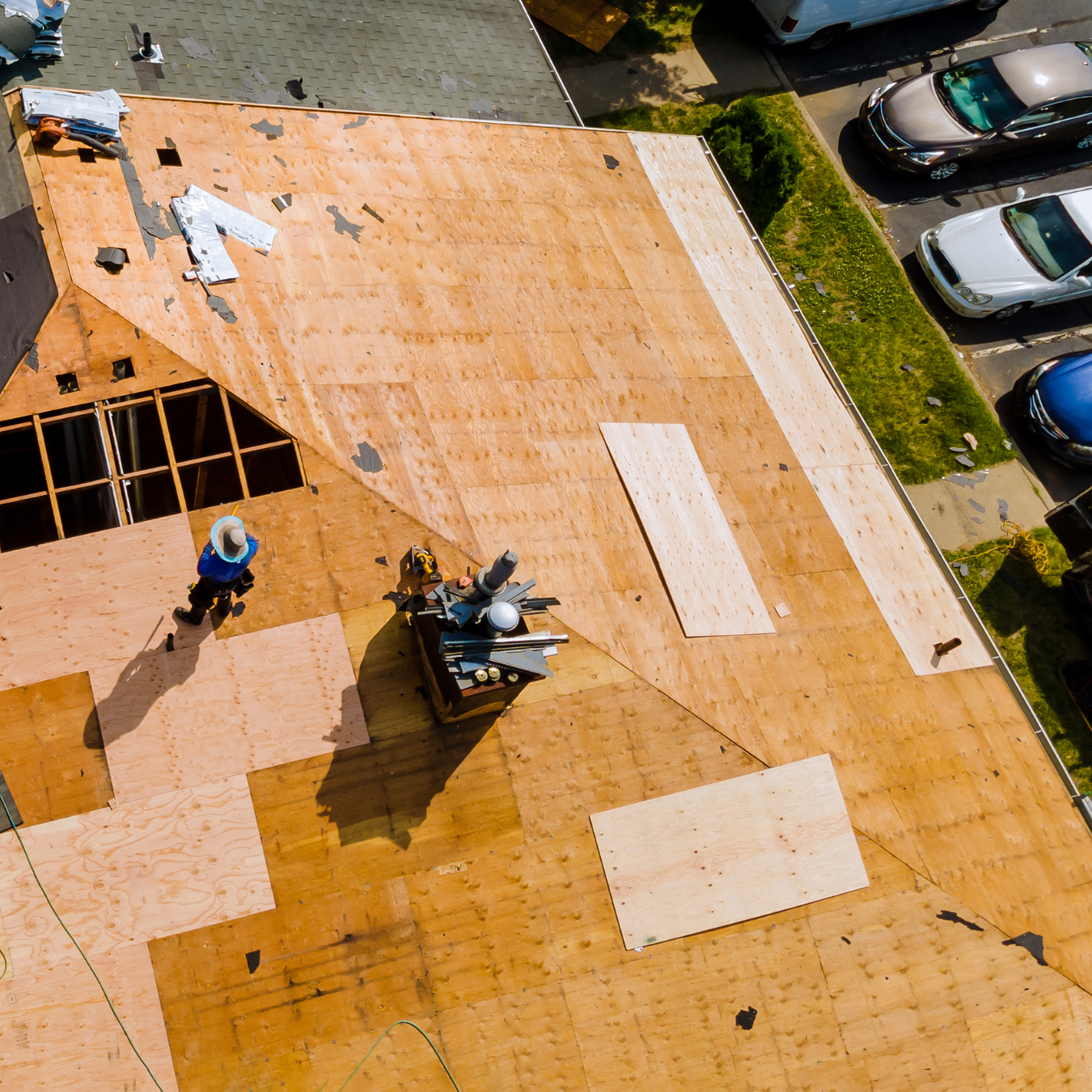 Professional DMV roofers working on roof decking