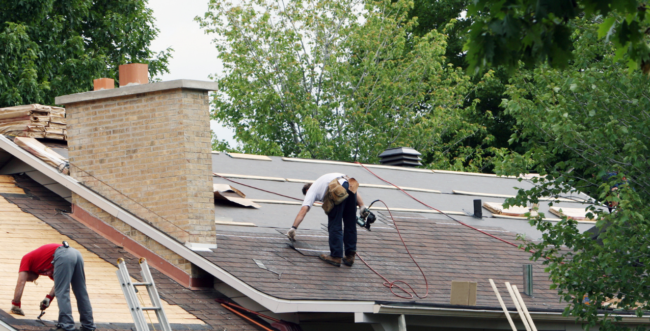 Professional roofing team in the DMV area working on roof repair