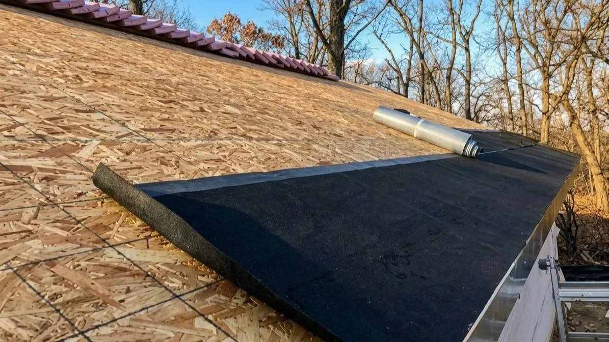 Ice and water shield being prepared to be installed