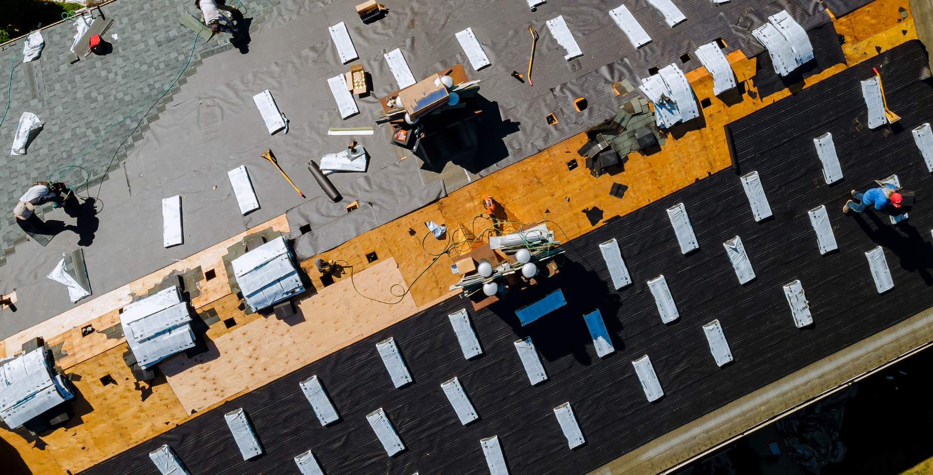 Roofers installing roofing materials on a home in Maryland