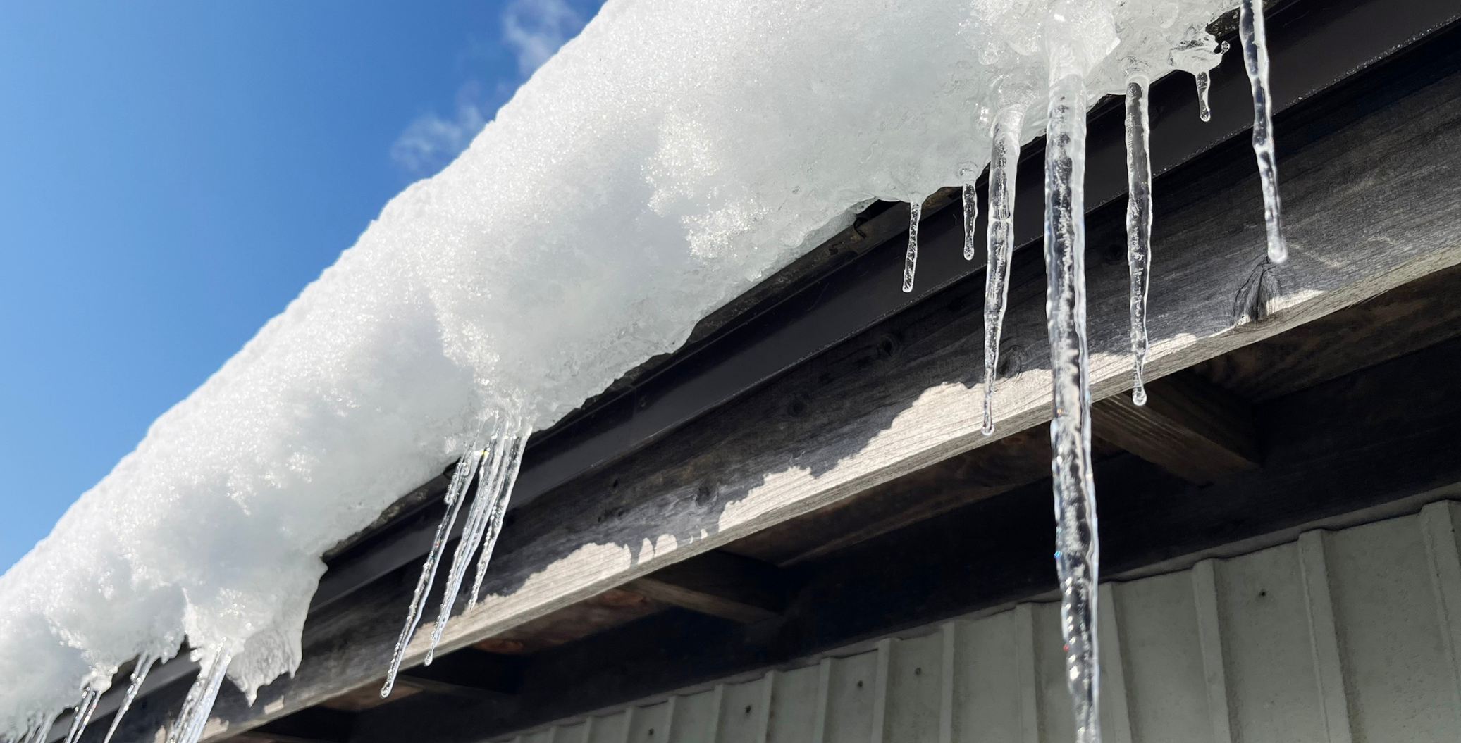 Example of ice dams on a roof in cold DMV winter conditions