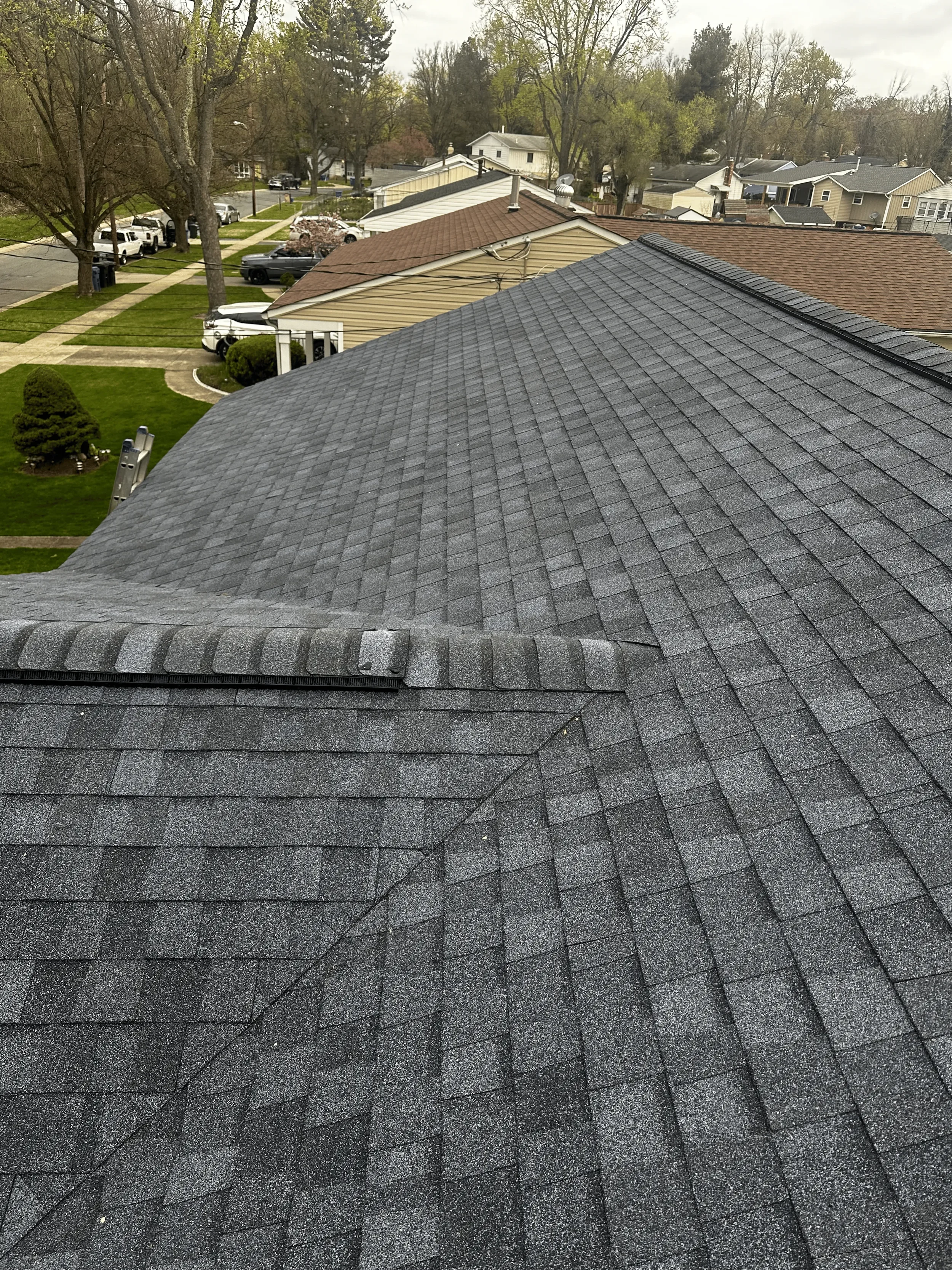 A finished gray roof worked on by DA Roofers 