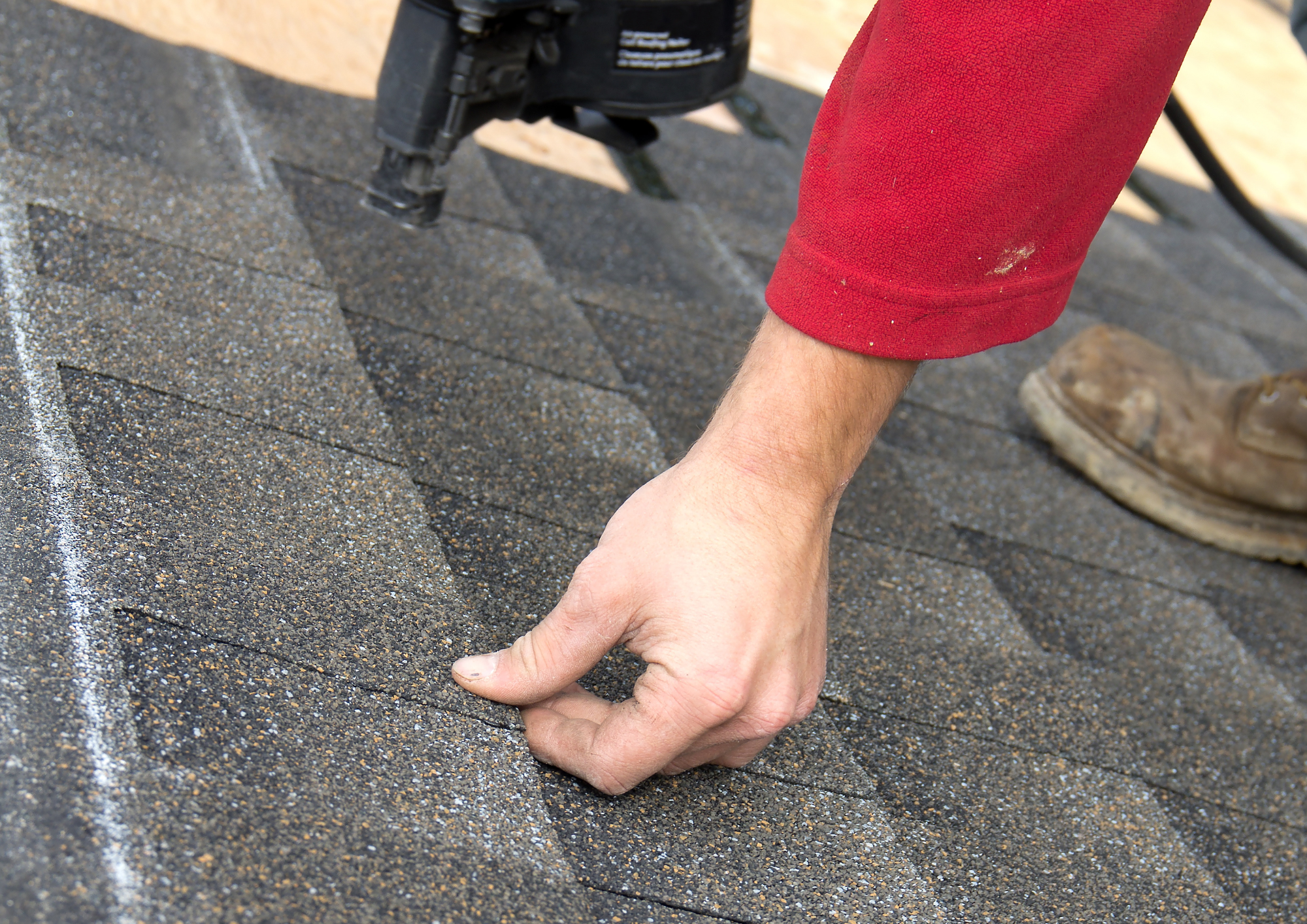 Close-up of roof damage and temporary fixes spotted by professional roofers