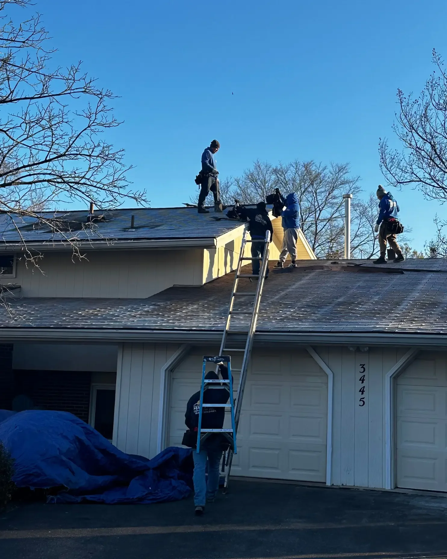 DA'Roofers inspecting house for roof insurance in Maryland