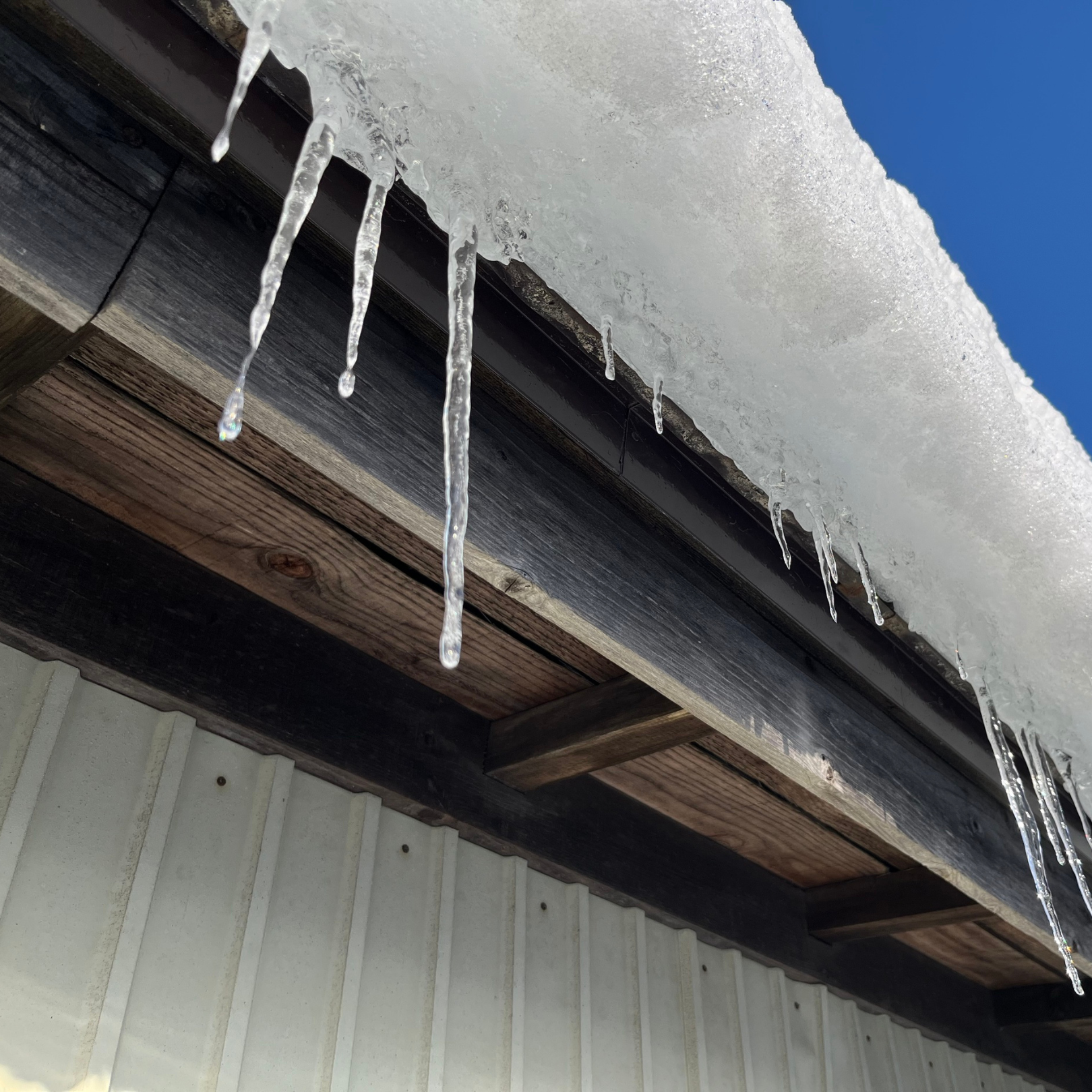 ce dam forming on a residential roof during winter in the DMV area