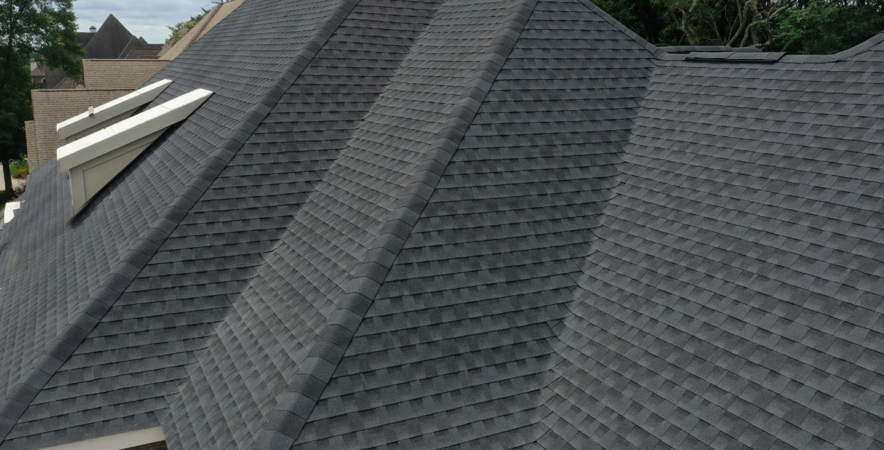 Residential roof with shingles, guide on roof lifespan