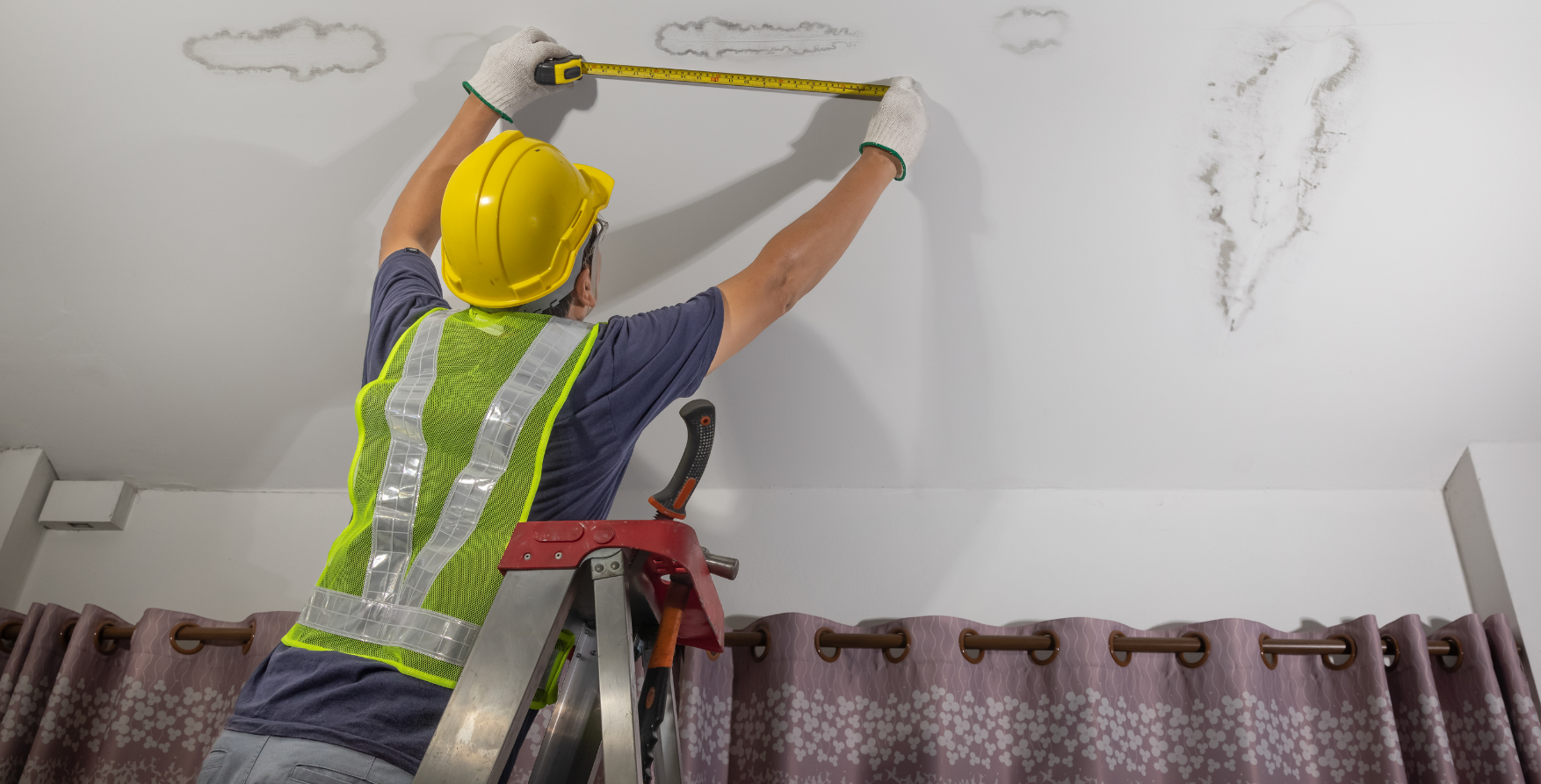 Roofing professional assessing leak repair cost on residential roof in DMV