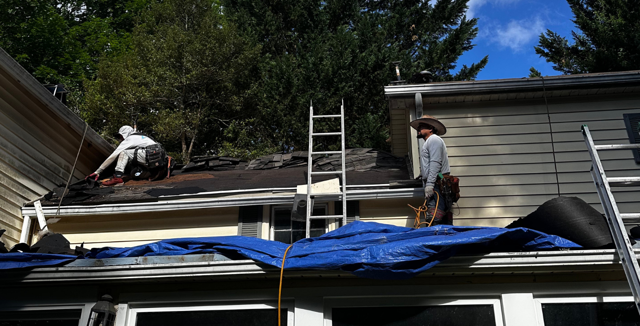 Skilled roofing professionals completing a residential roofing project in the DMV