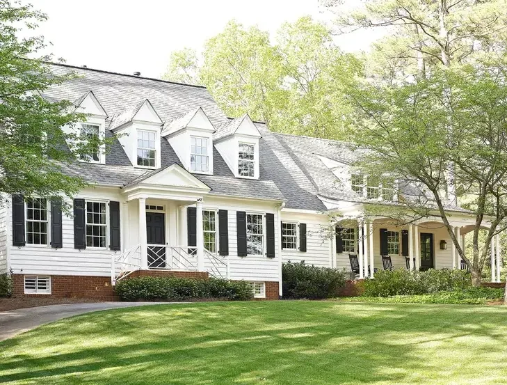 A white house with a gray roof