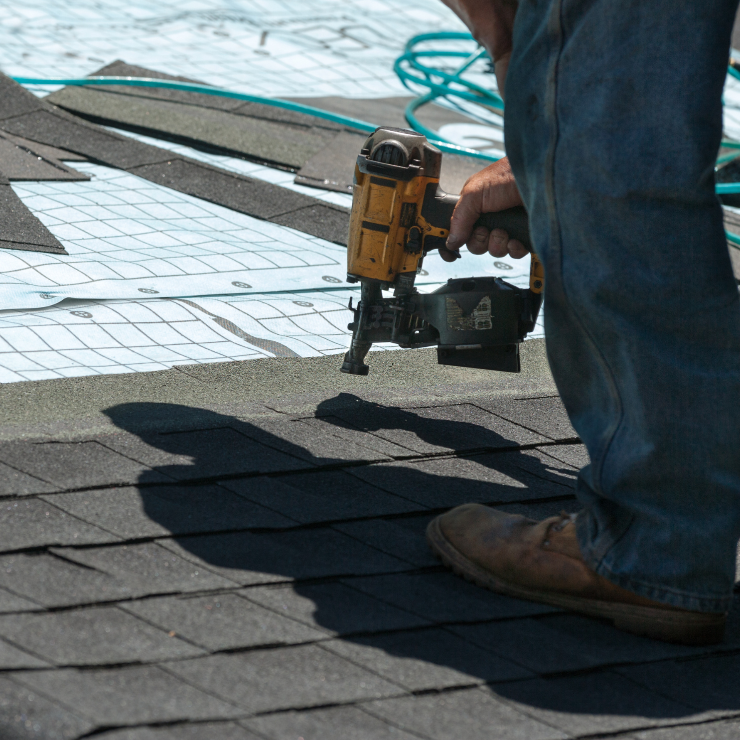 Roofing professional performing roof work in Maryland