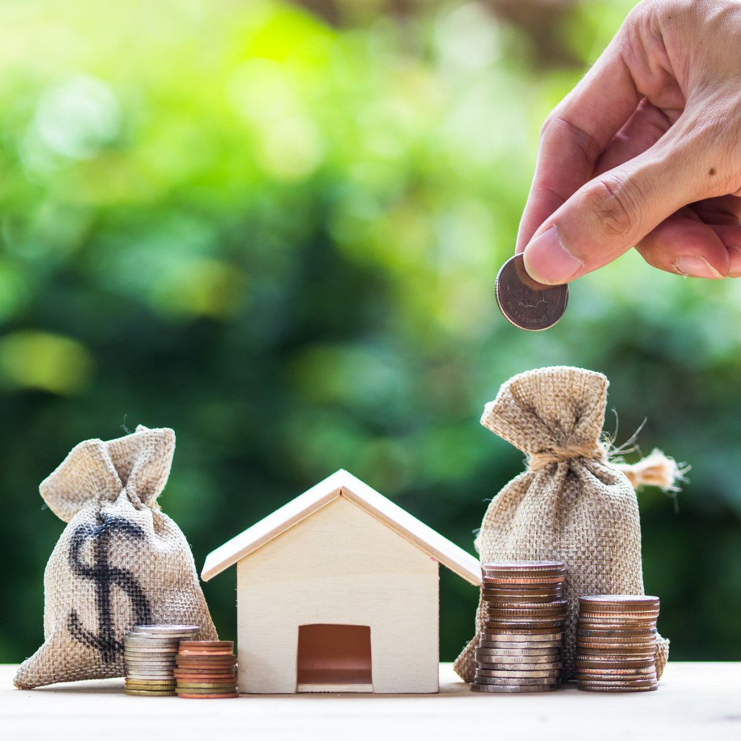 Home model and roof representing the cost of a new roof installation.