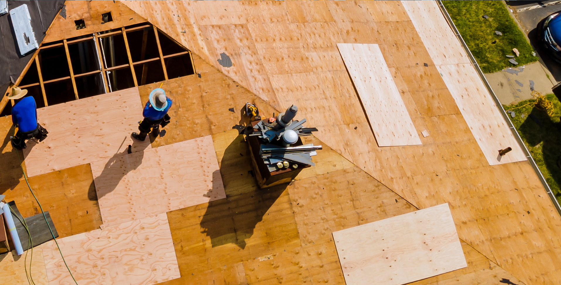 Professional DMV roofers working on roof decking