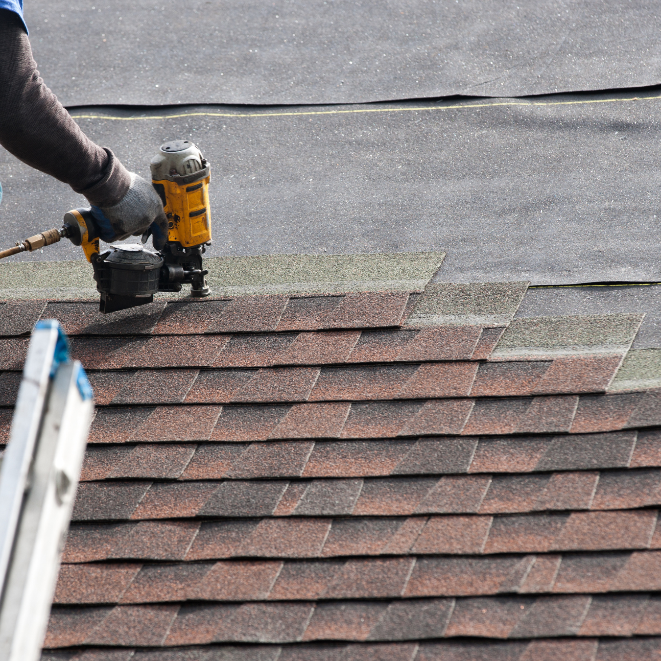 DMV roofer installing asphalt shingles