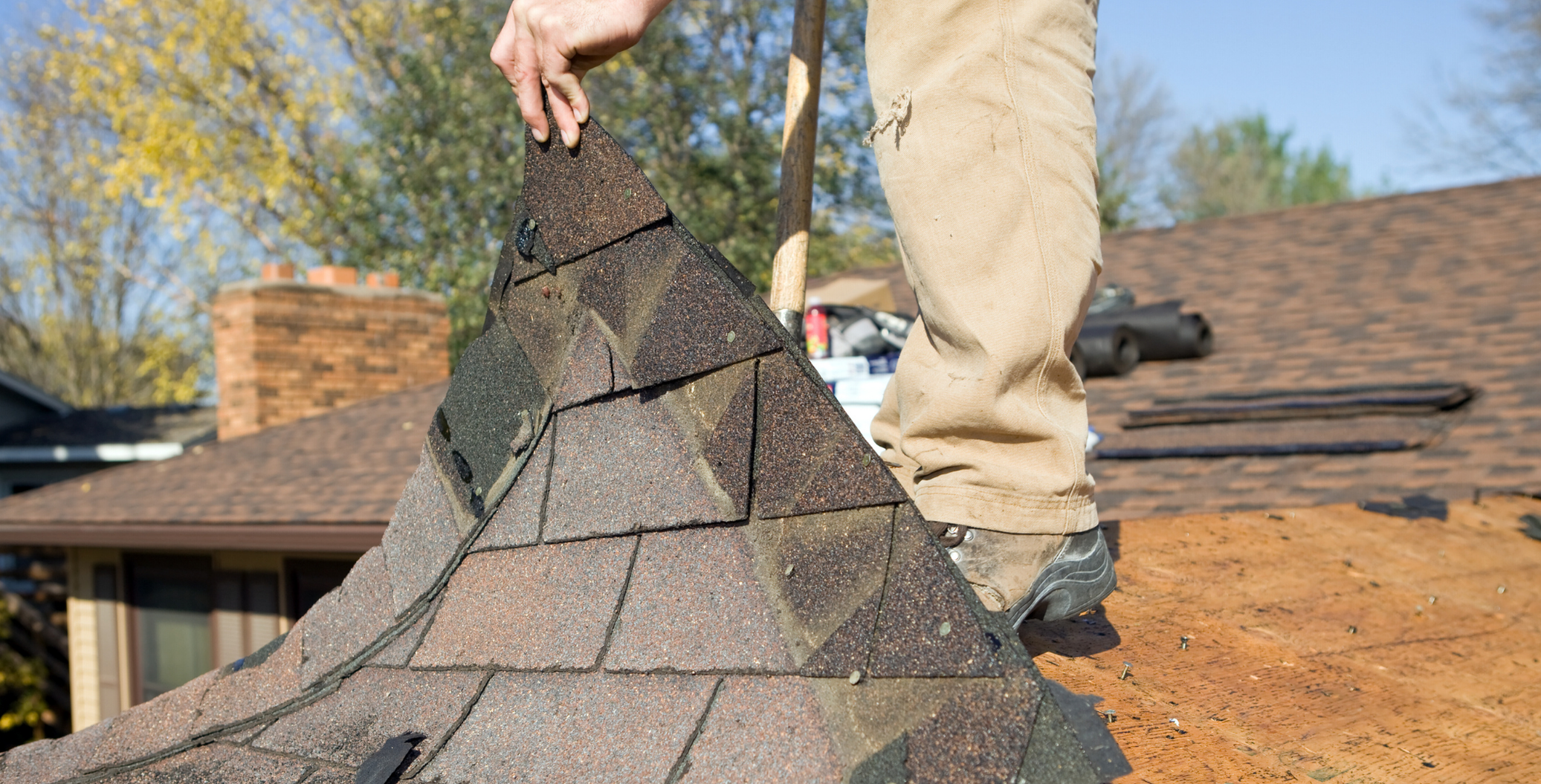 DMV Roofer removing old roofing materials before replacement