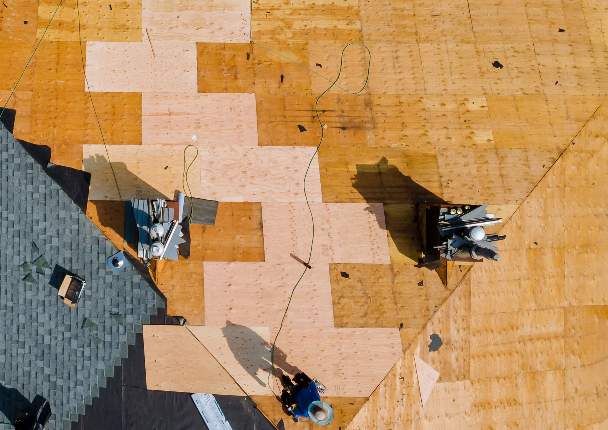 New plywood installed after removing damaged roof decking