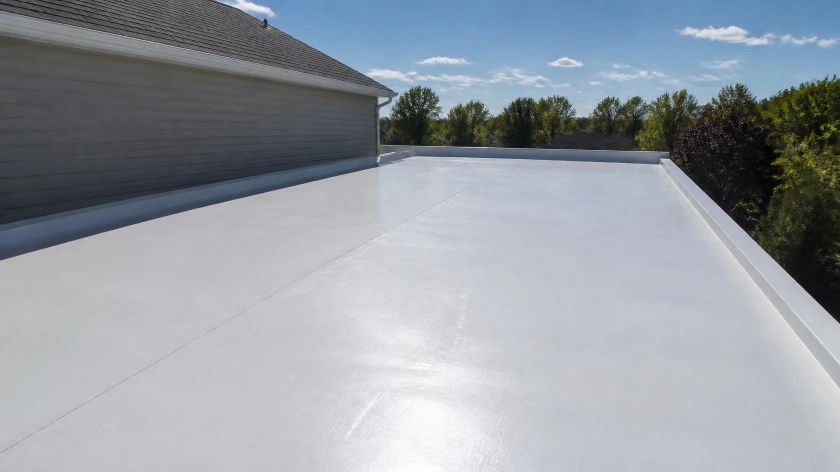 A white PVC membrane roof reflecting sunlight on a Maryland home.