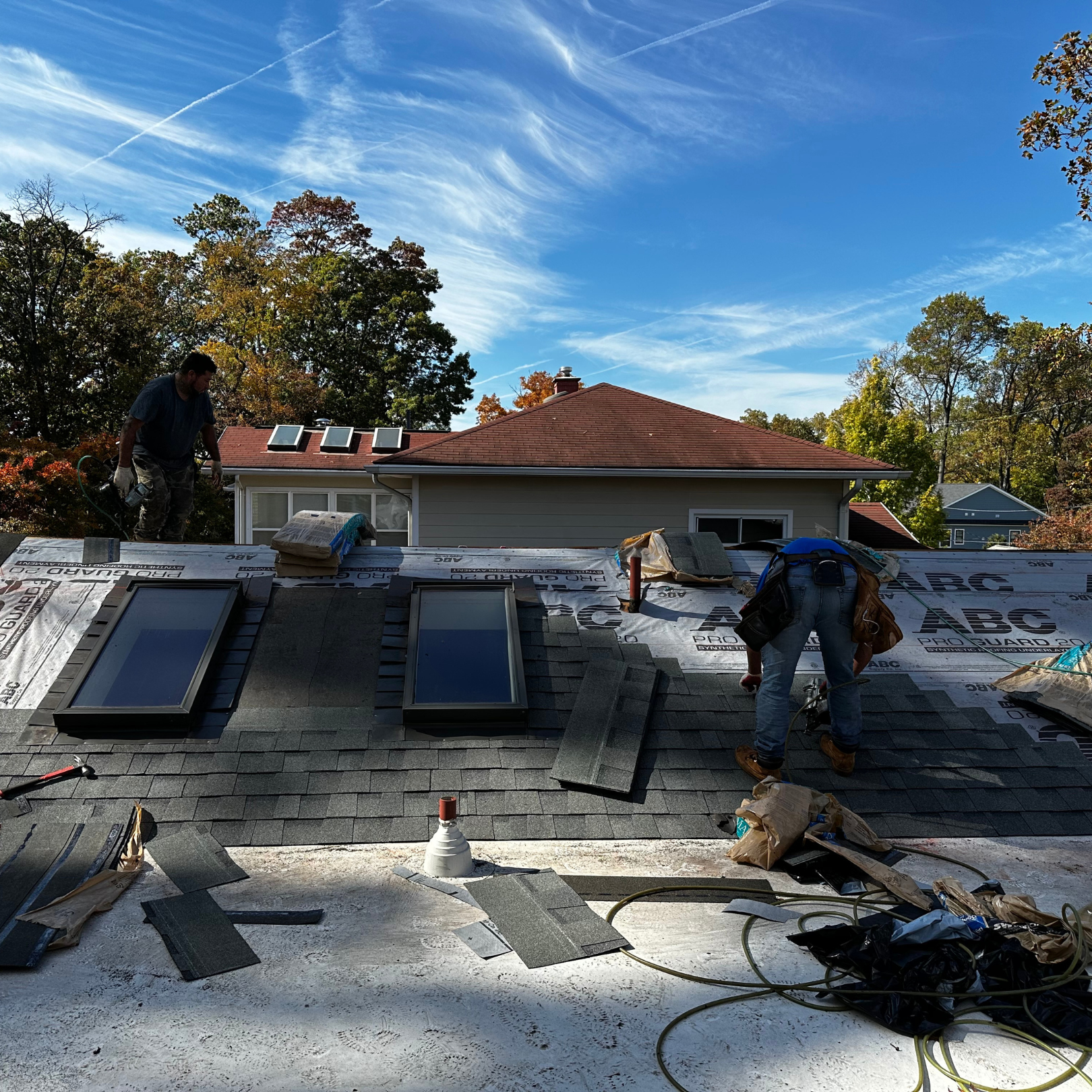 DMV licensed roofer working on residential roof
