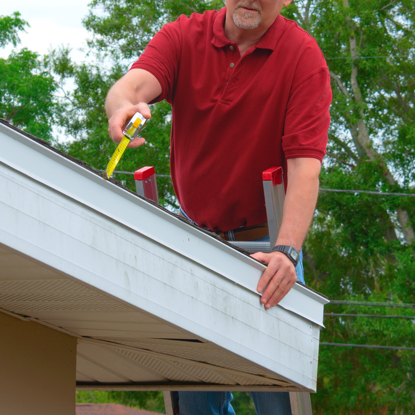 Roofer performing a general roof inspection in the DMV