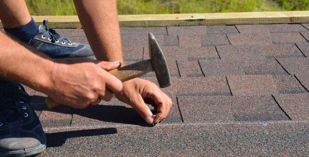 Homeowner attempting DIY roof replacement on a house