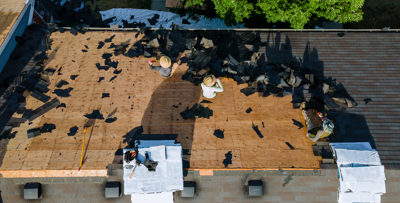 Team of licensed dmv roofers working on roof replacement