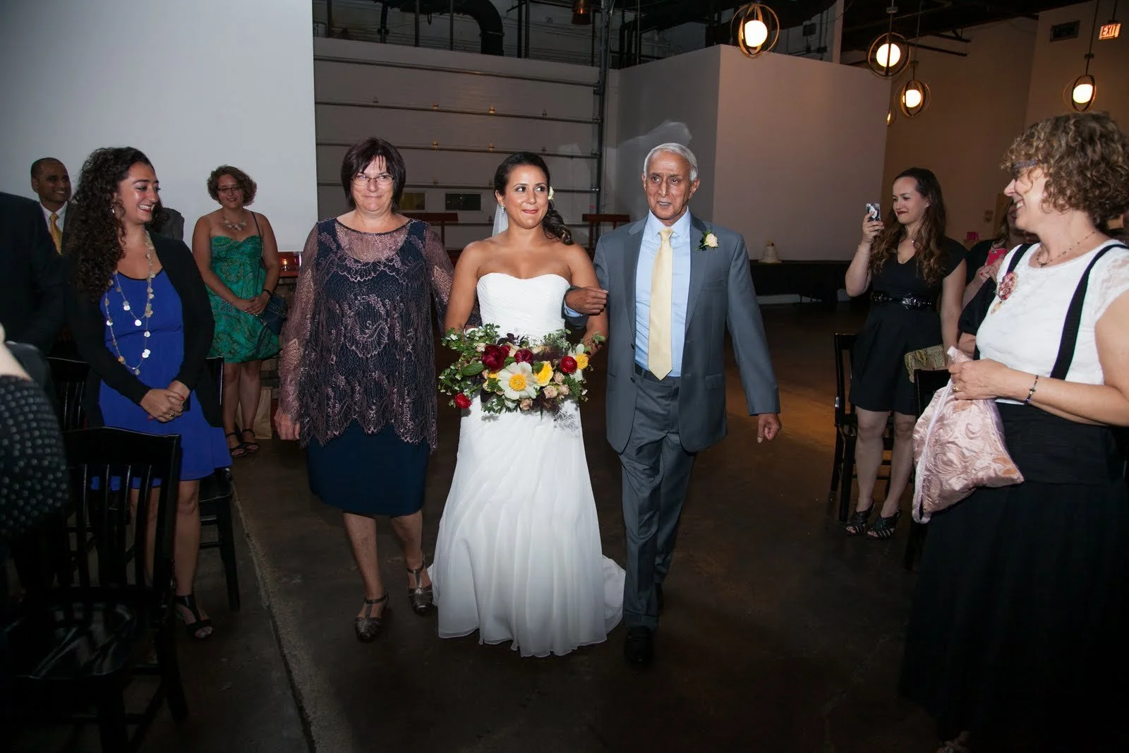 Zahir & Janet walking Leila down the aisle, 2015