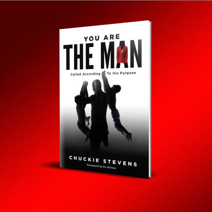 Book titled "You Are The Man" by Chuckie Stevens with cover featuring a silhouette of three men, one wearing a red jacket, against a gradient background from red to white.