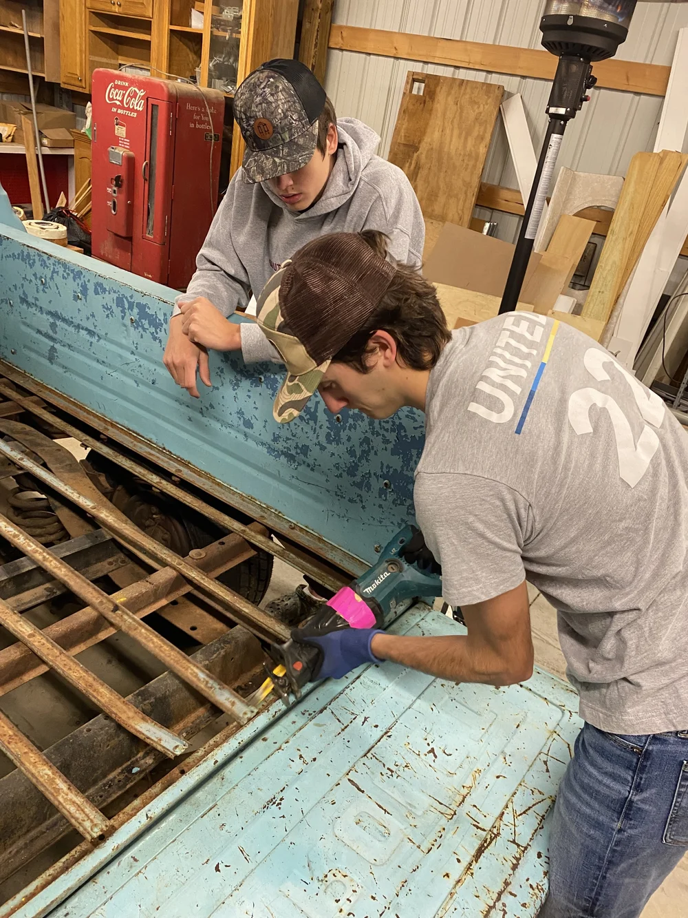 Father and sons working together on Ole Blue