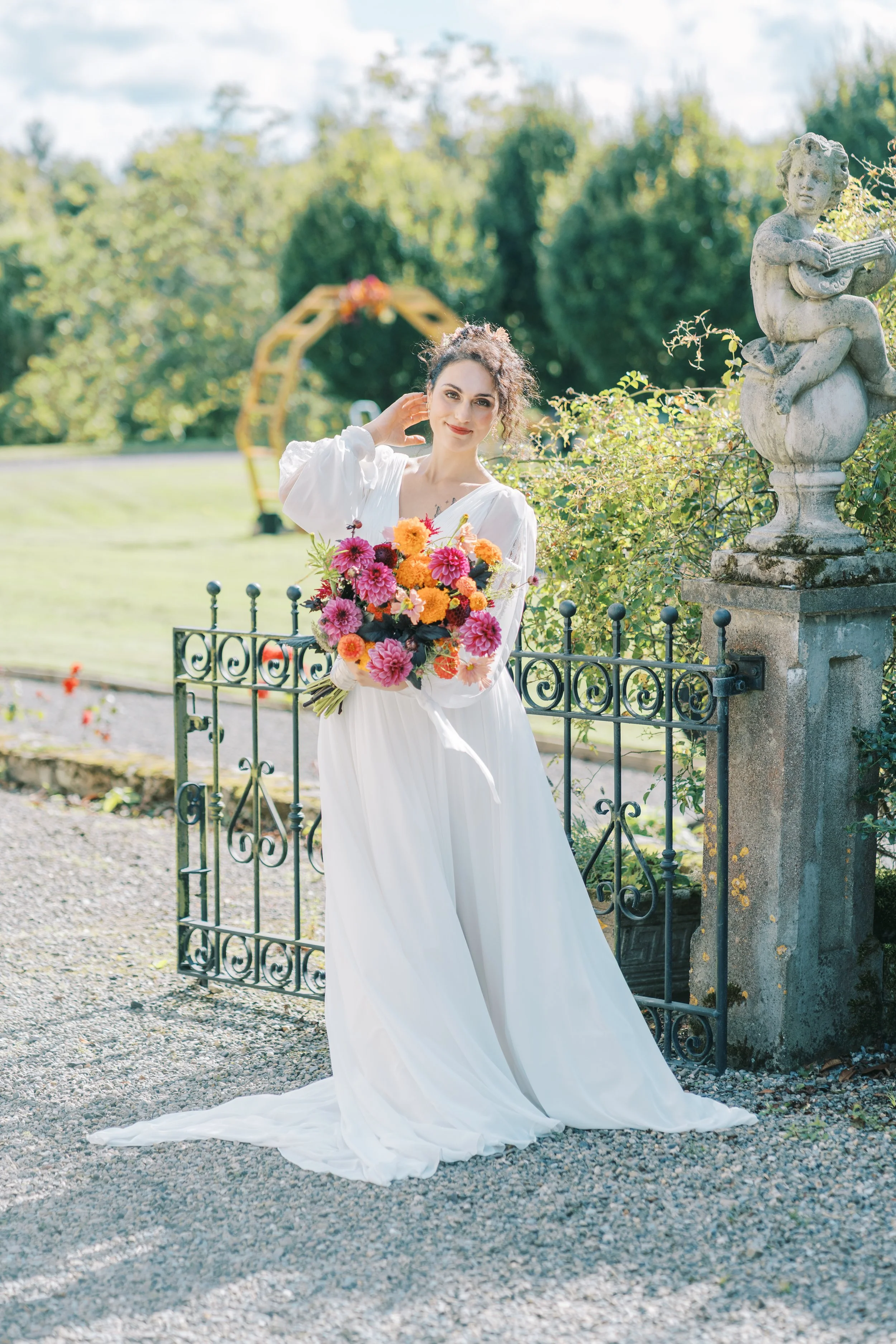 Seasonal hand-tied wedding bouquet with garden dahlias, greenery, and wild Irish blooms at a Cork City wedding