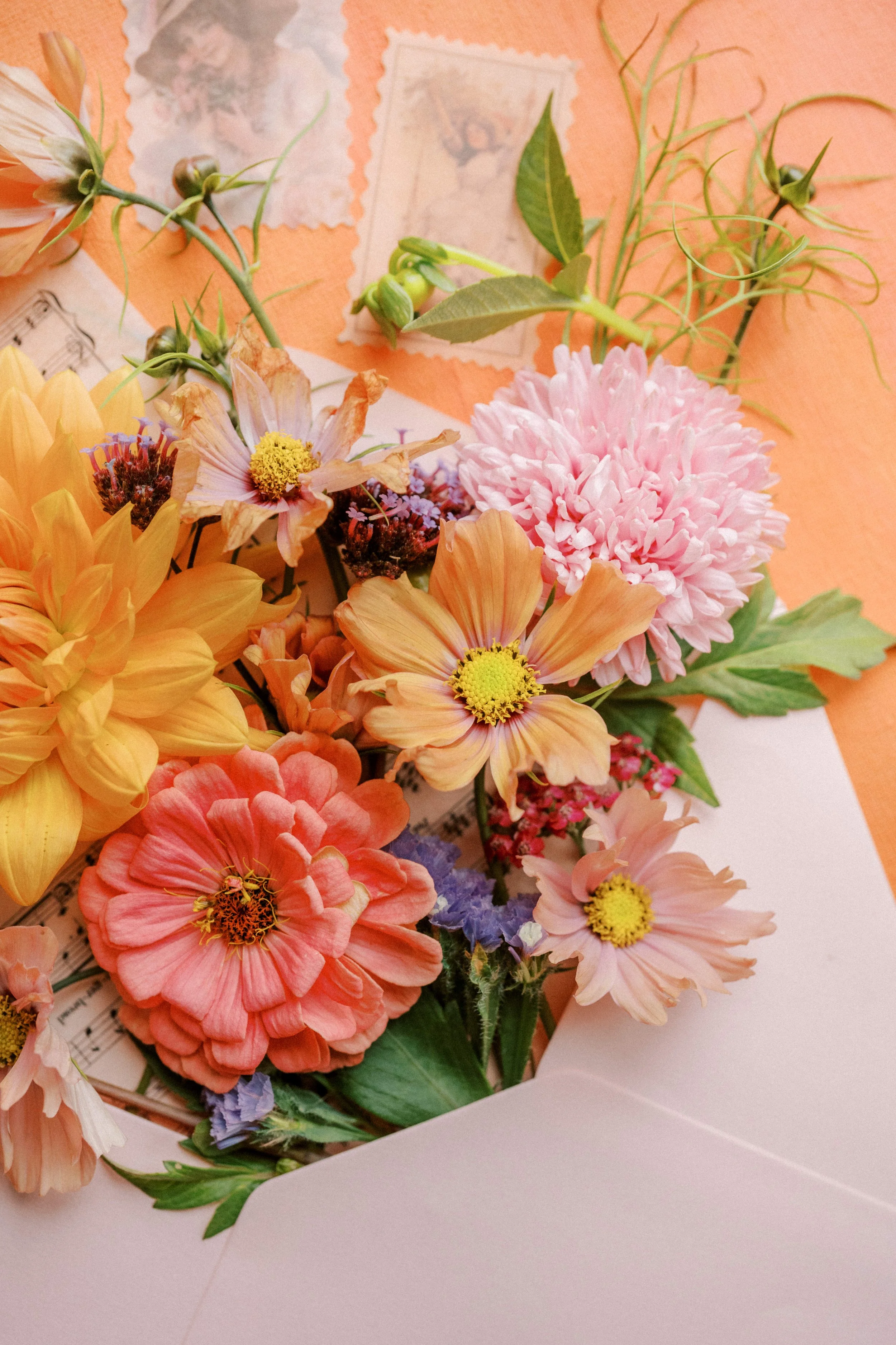 Bridal details flatlay with soft seasonal flowers grown in Ireland.