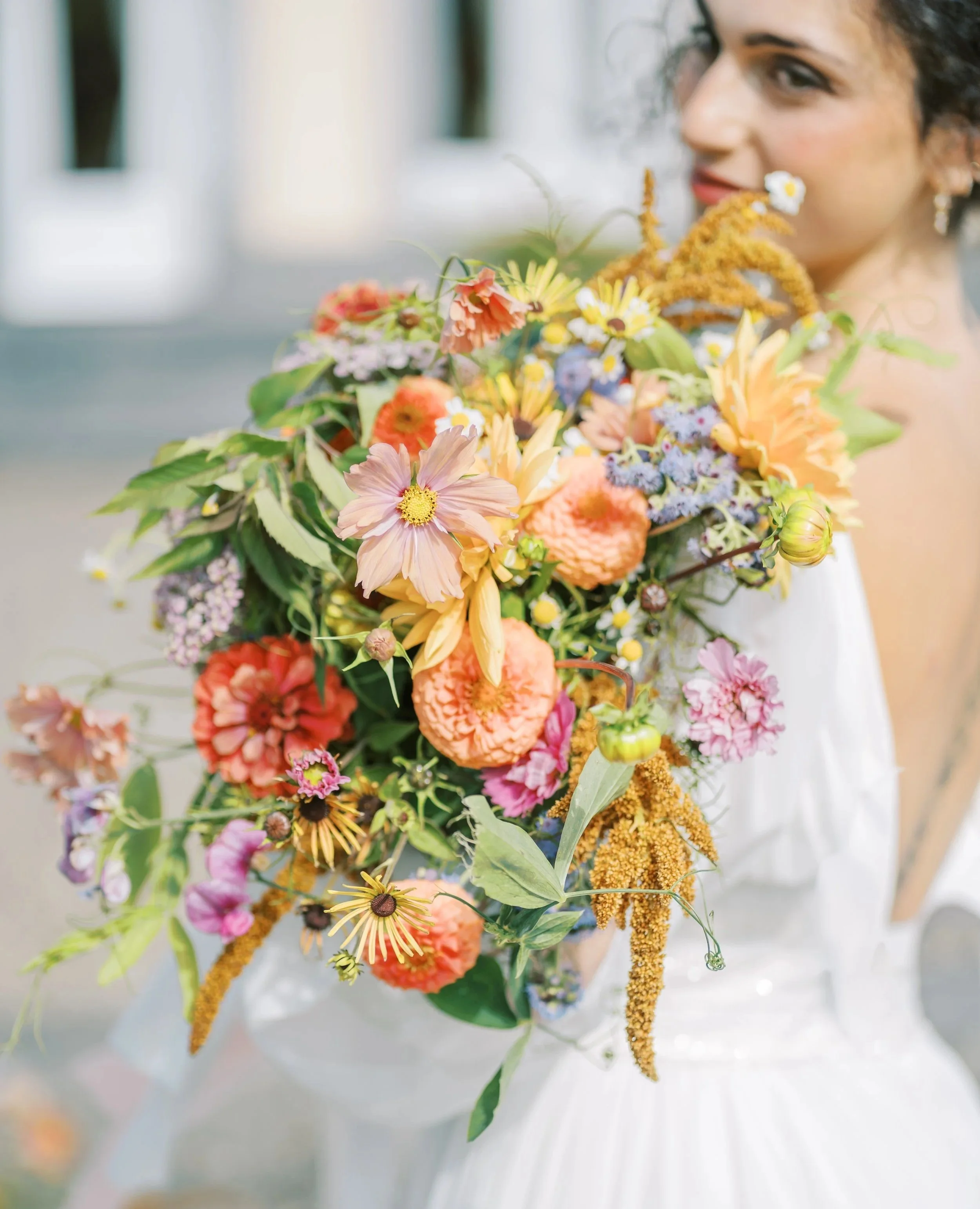 Wild pastel wedding bouquet with cream, apricot, and dusty blue Irish-grown flowers in Waterford