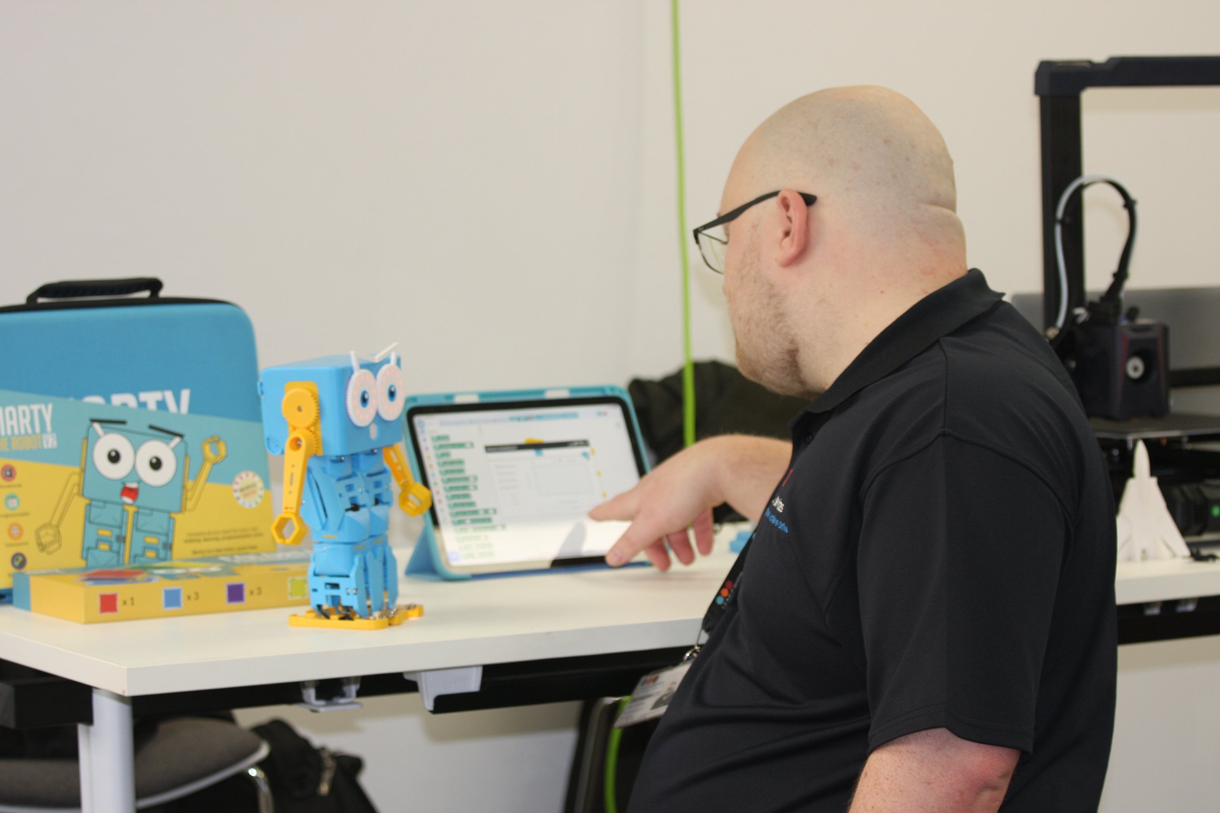Our tech Dan H setting up MARTY the robot  at M.E.E.T. 2023