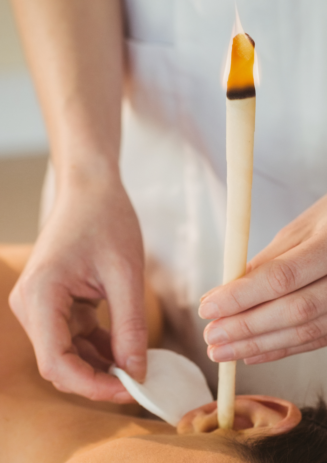 Client receiving gentle ear candling at Joy’s Special Touch